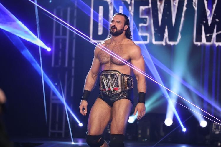 Discover bars and venues showing live pro wrestling events with a lively crowd and big-screen viewing.