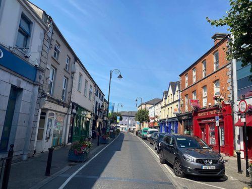 For a proper Irish pub atmosphere, head to Main Street in Portlaoise, where sports bars and traditional pubs show live GAA, rugby, and football on big screens, with pints flowing and a lively crowd on match days.